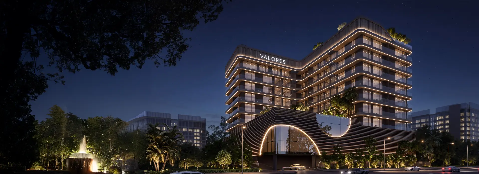 Valores Residences, Al Furjan, Dubai - illuminated facade at night with the Valores rooftop signage